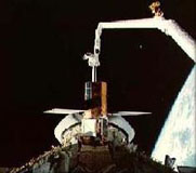 Canadarm releasing a satellite